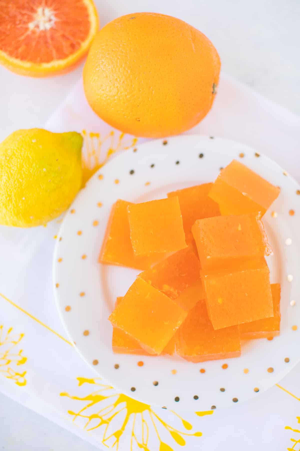 serving of homemade healthy orange jello slices on a plate.