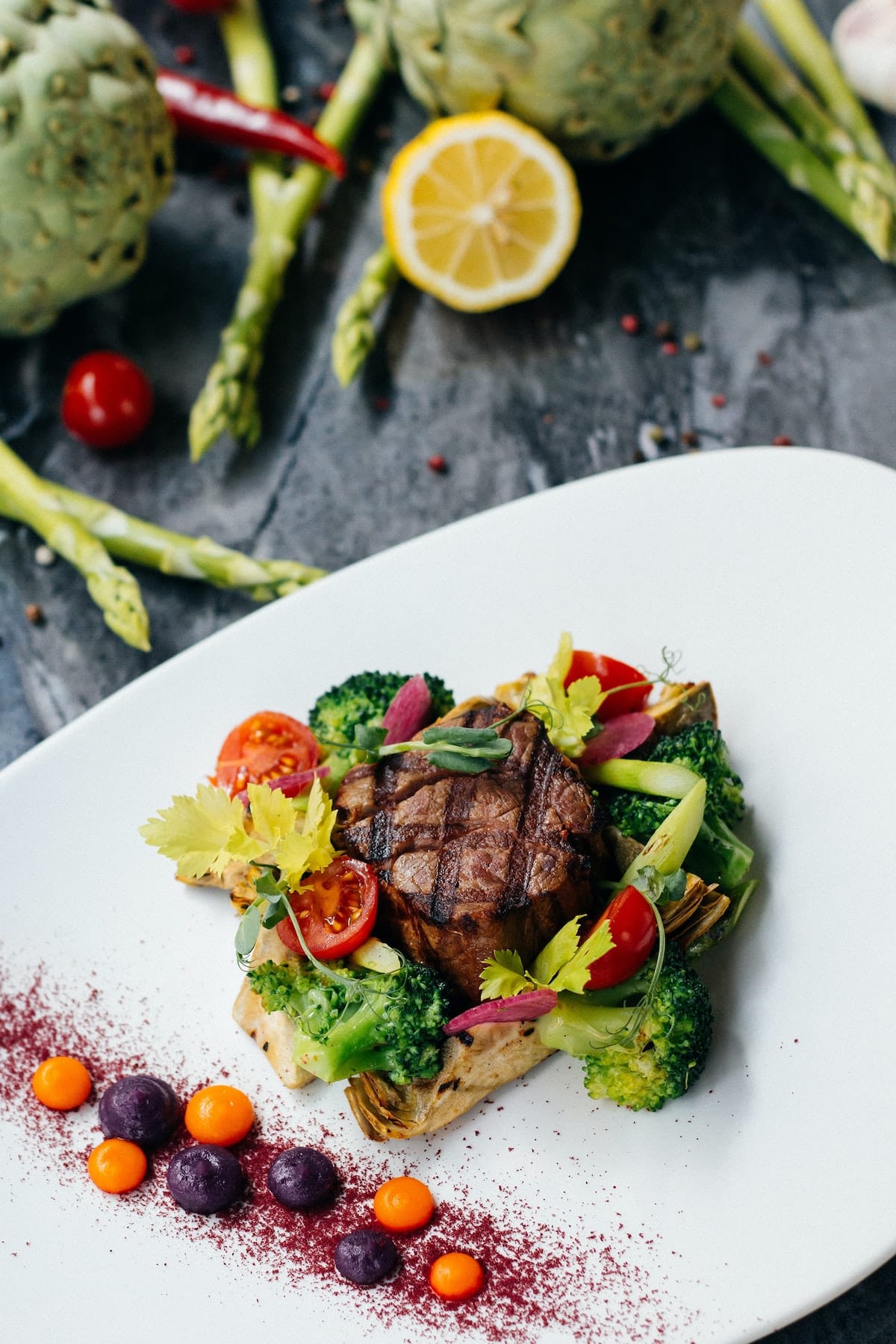 cooked steak with vegetables on a plate.