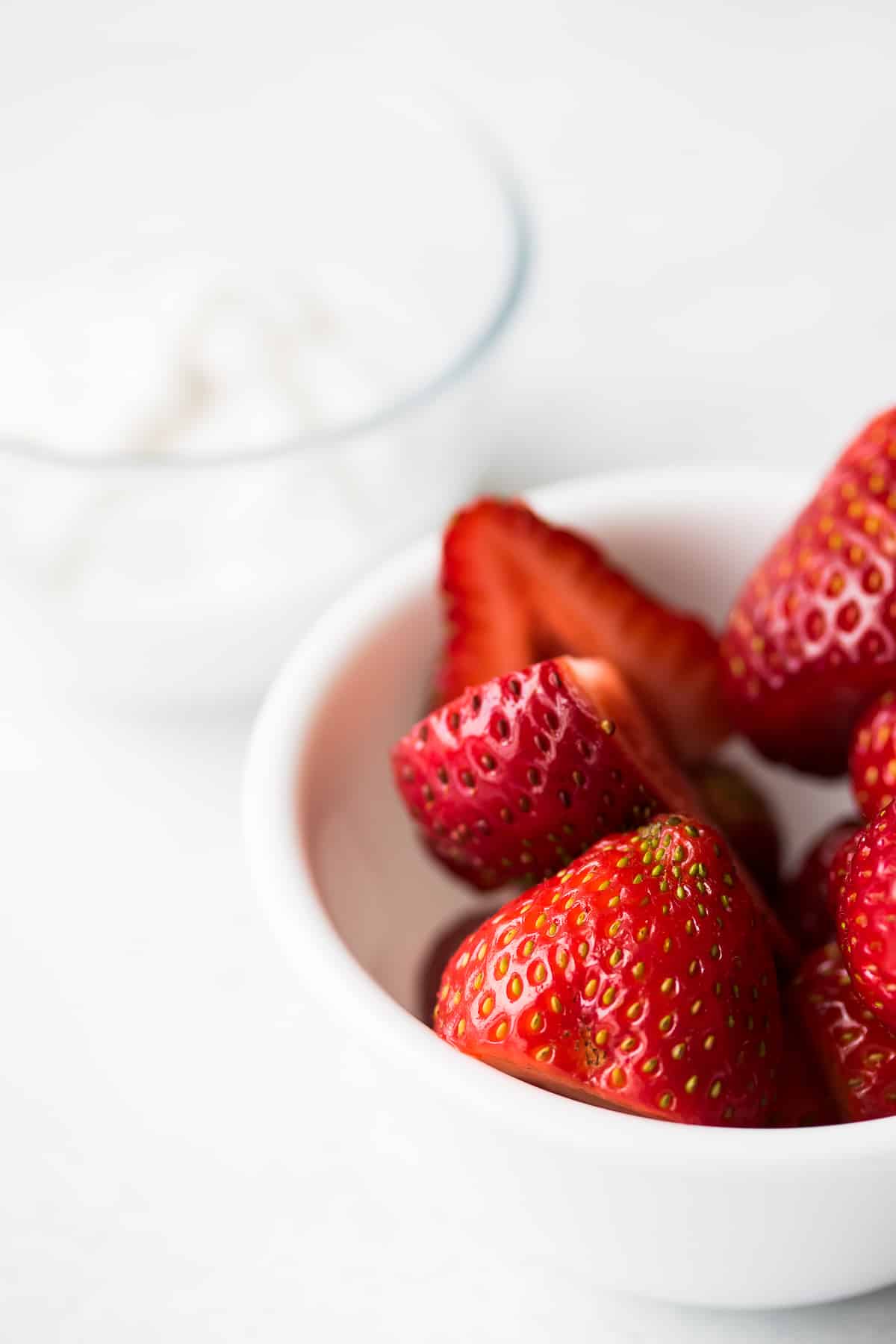 bowl of strawberries with coconut yogurt