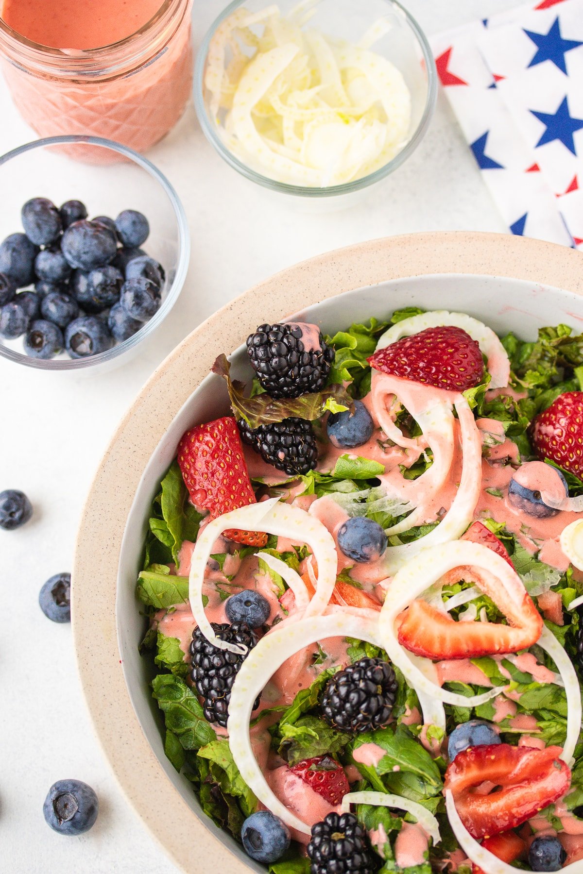 salad with strawberry dressing and patriotic napkin