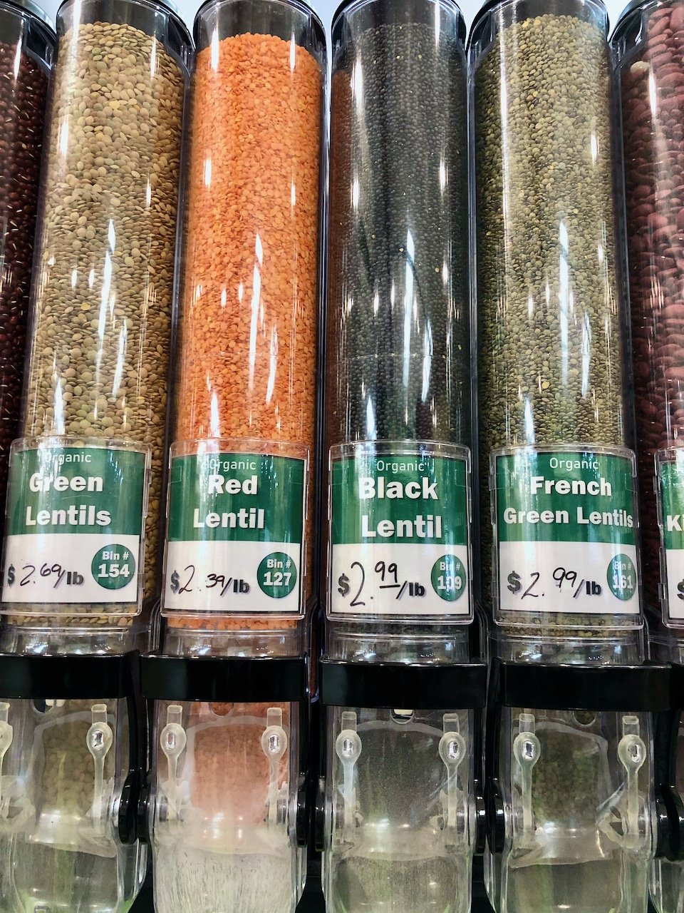 lentils in bulk bins at a healthy food store.