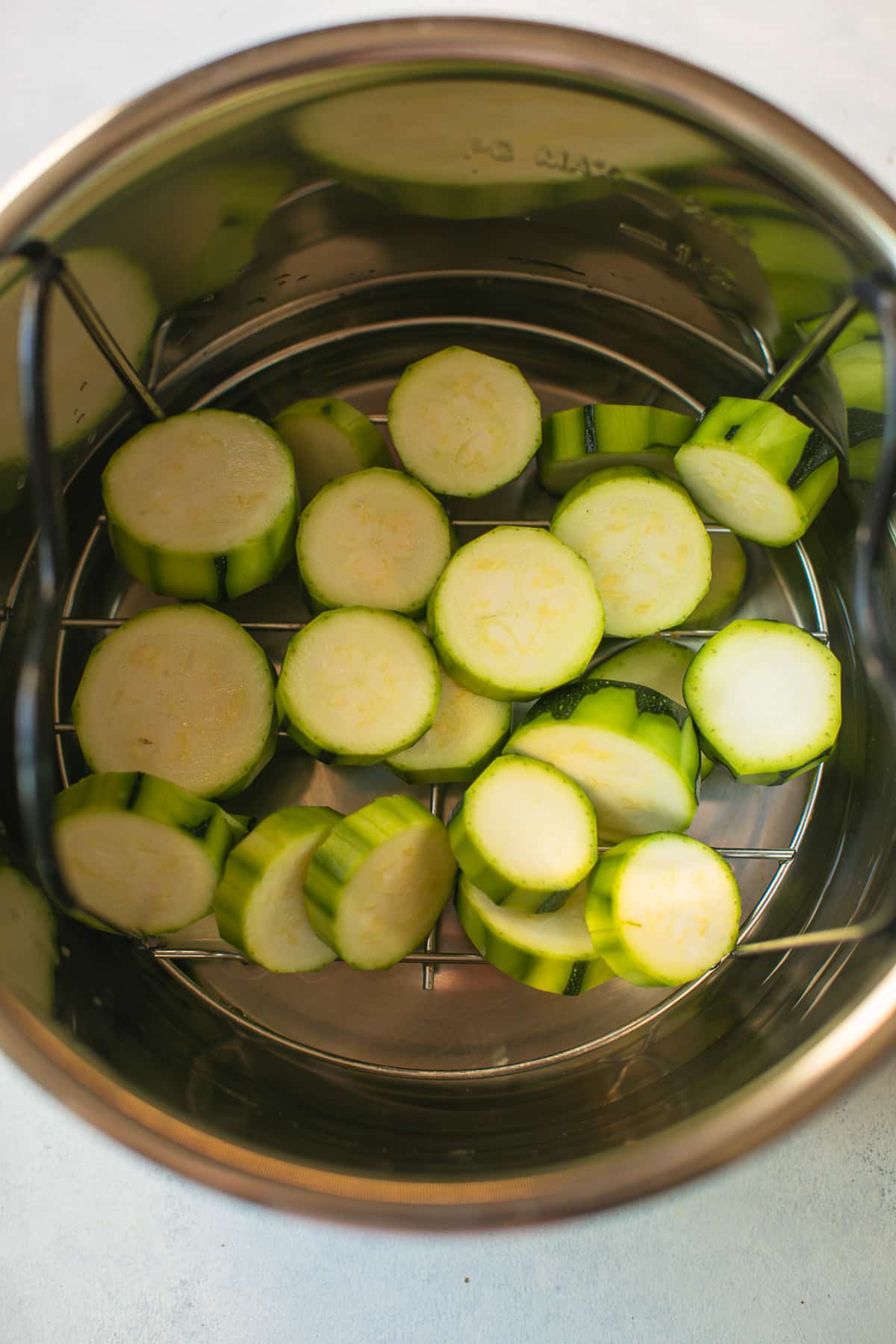 Zucchini slices inside an Instant Pot.