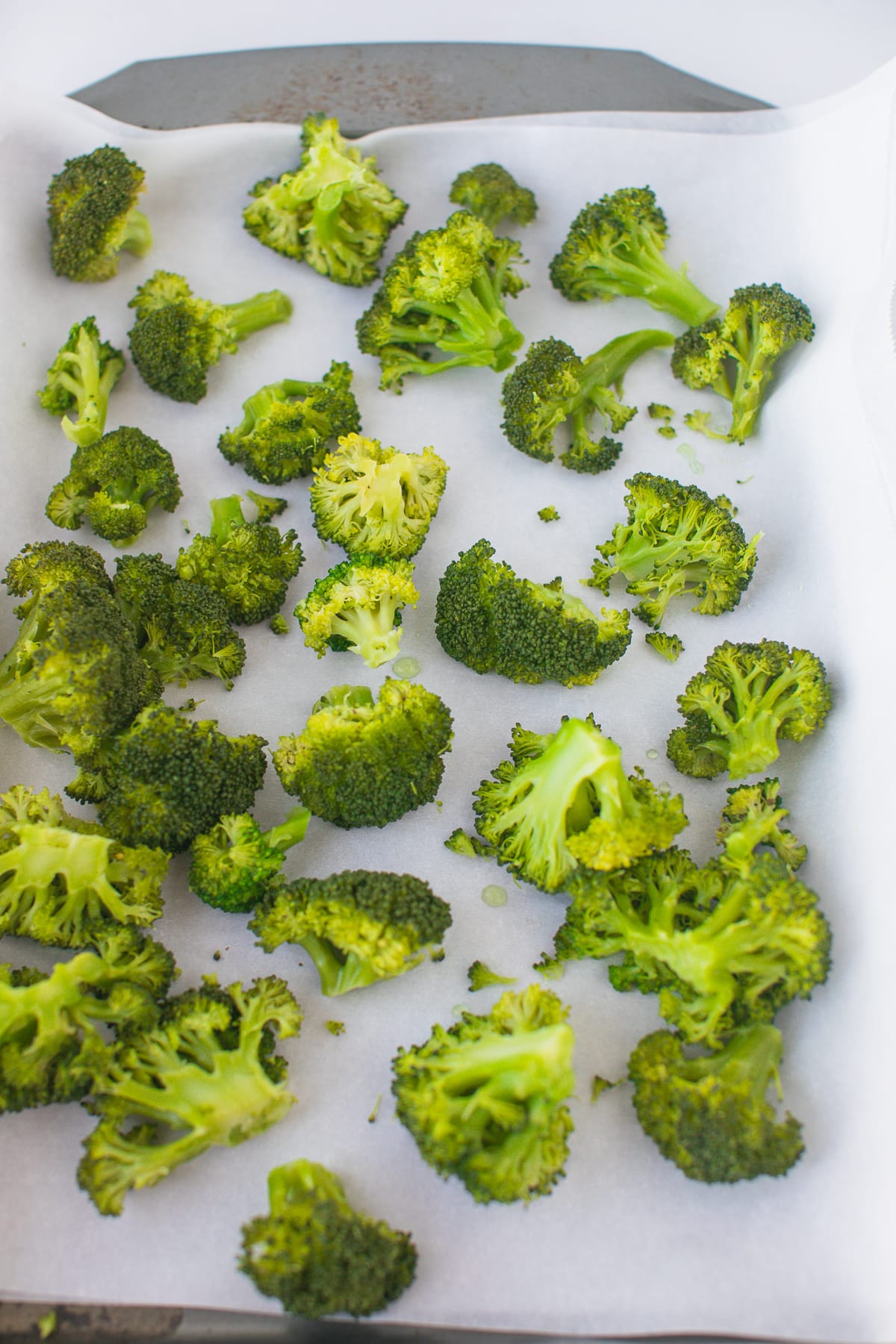 blanched broccoli on baking sheet.