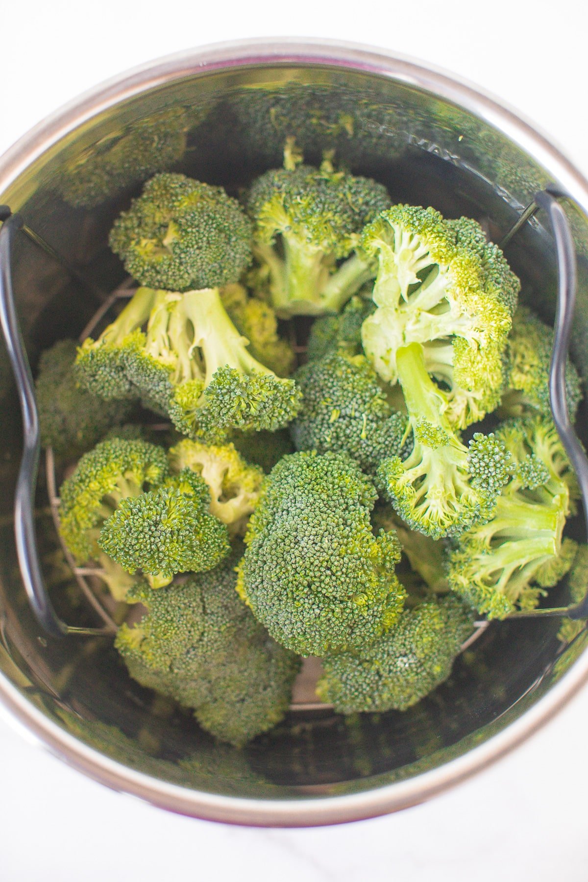broccoli florets on the trivet in an instant pot