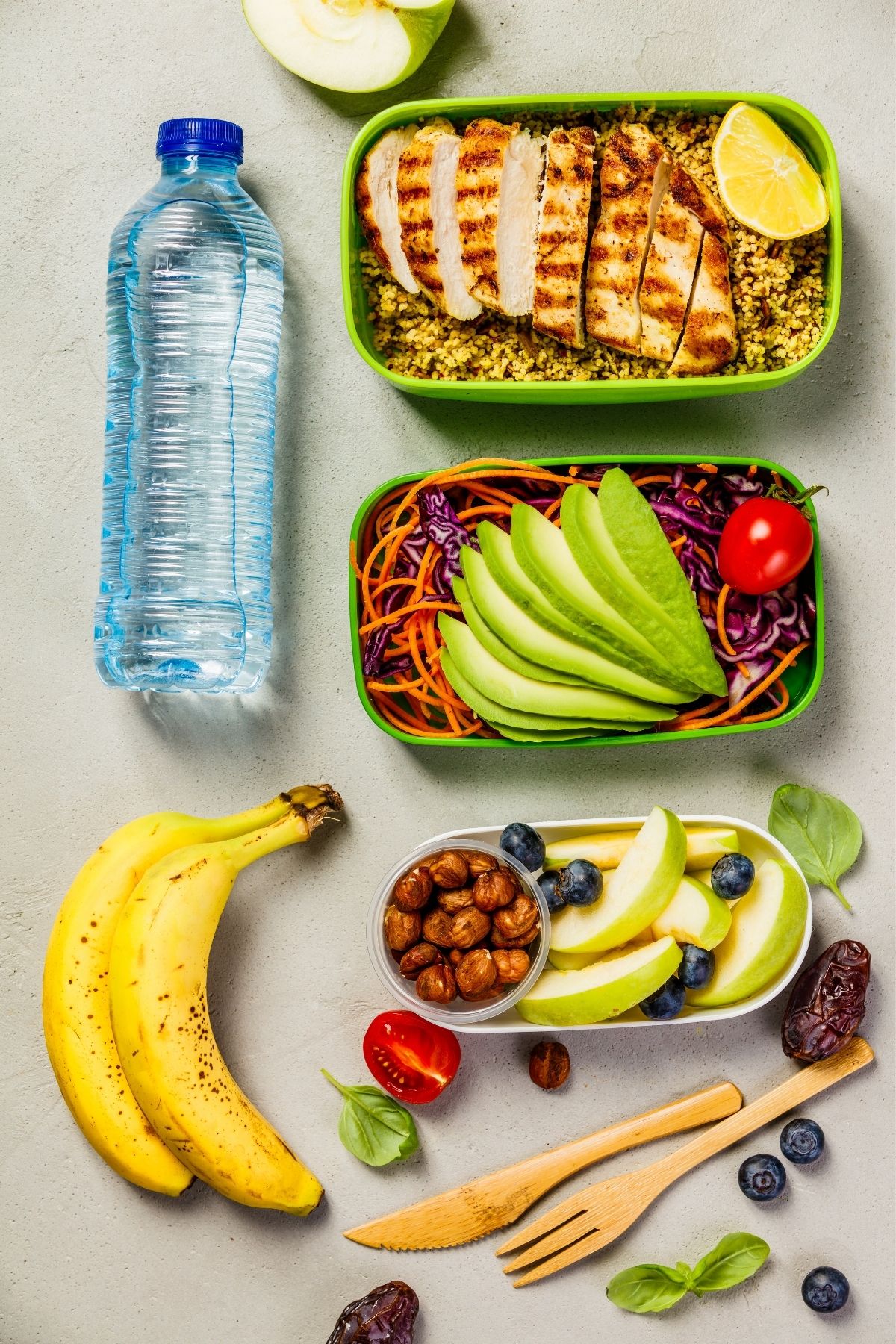 meal prepped foods with water and bananas