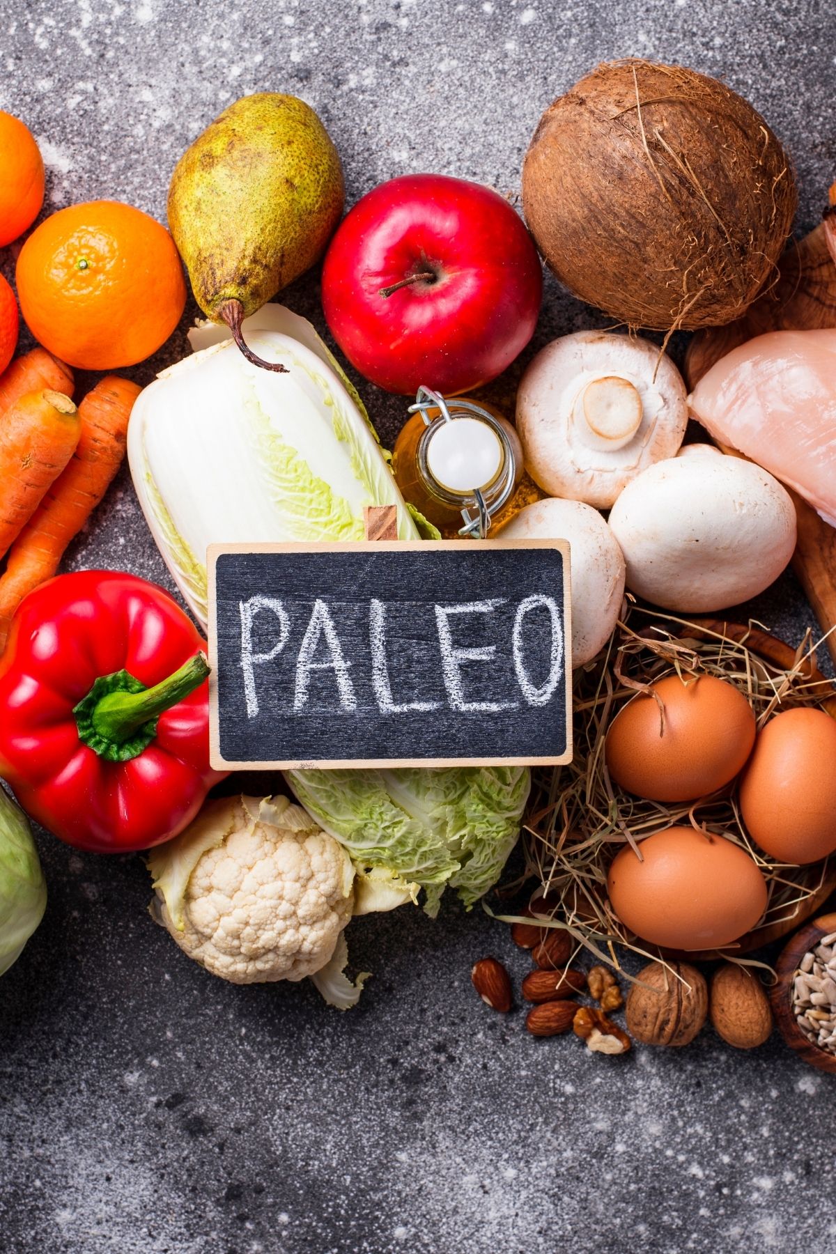 healthy foods on a countertop with a sign that says paleo.