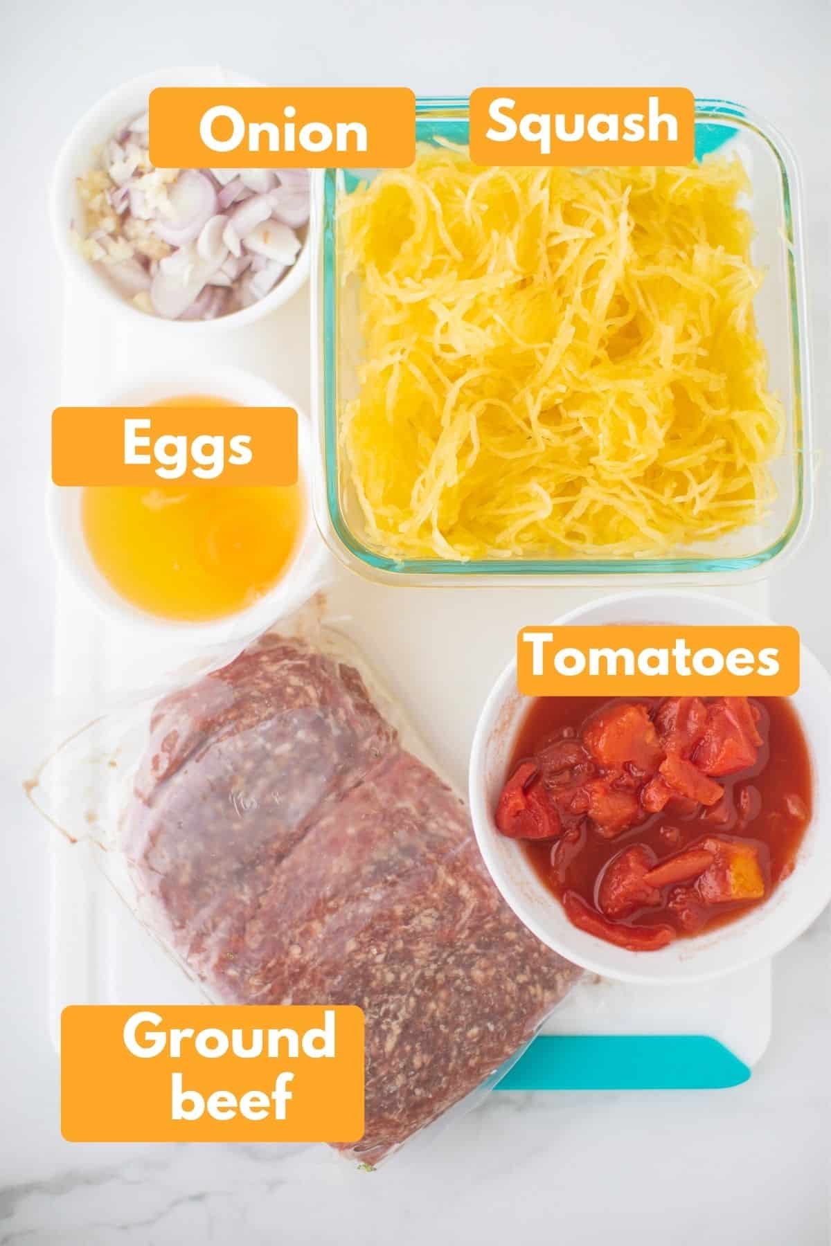 labeled photo with ingredients for spaghetti squash pizza casserole
