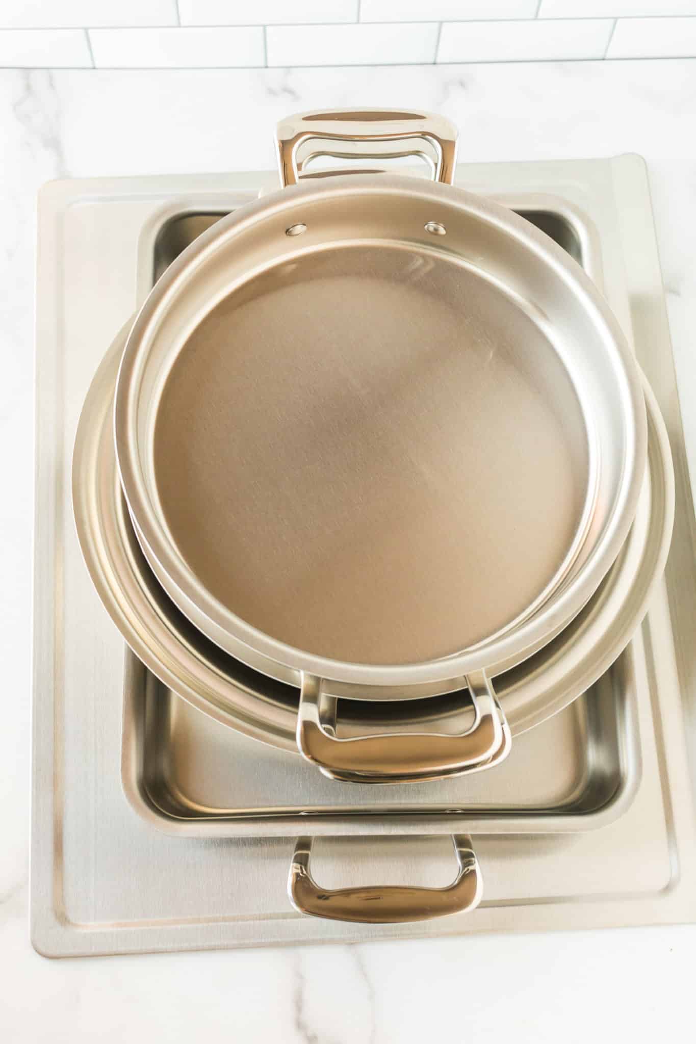 Stainless steel bakeware set made by 360 Cookware on a countertop.