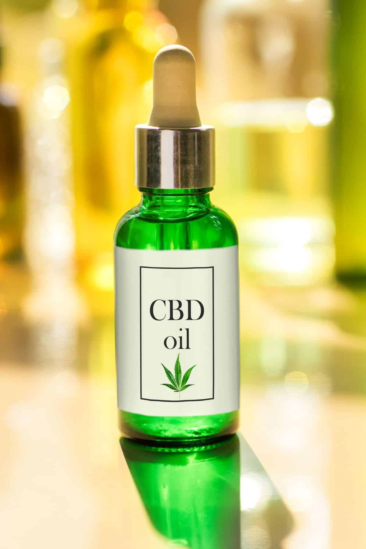 bottle of CBD oil in a green bottle