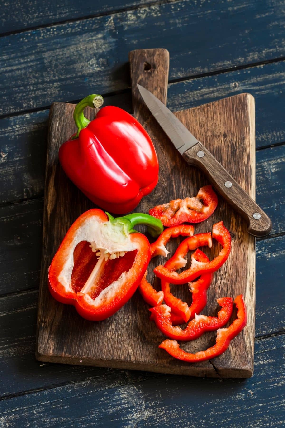 sliced red bell pepper on a cutting board.