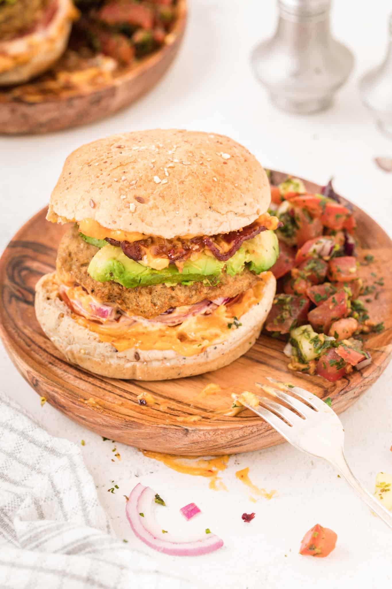 An air fryer turkey burger with avocado and bacon.