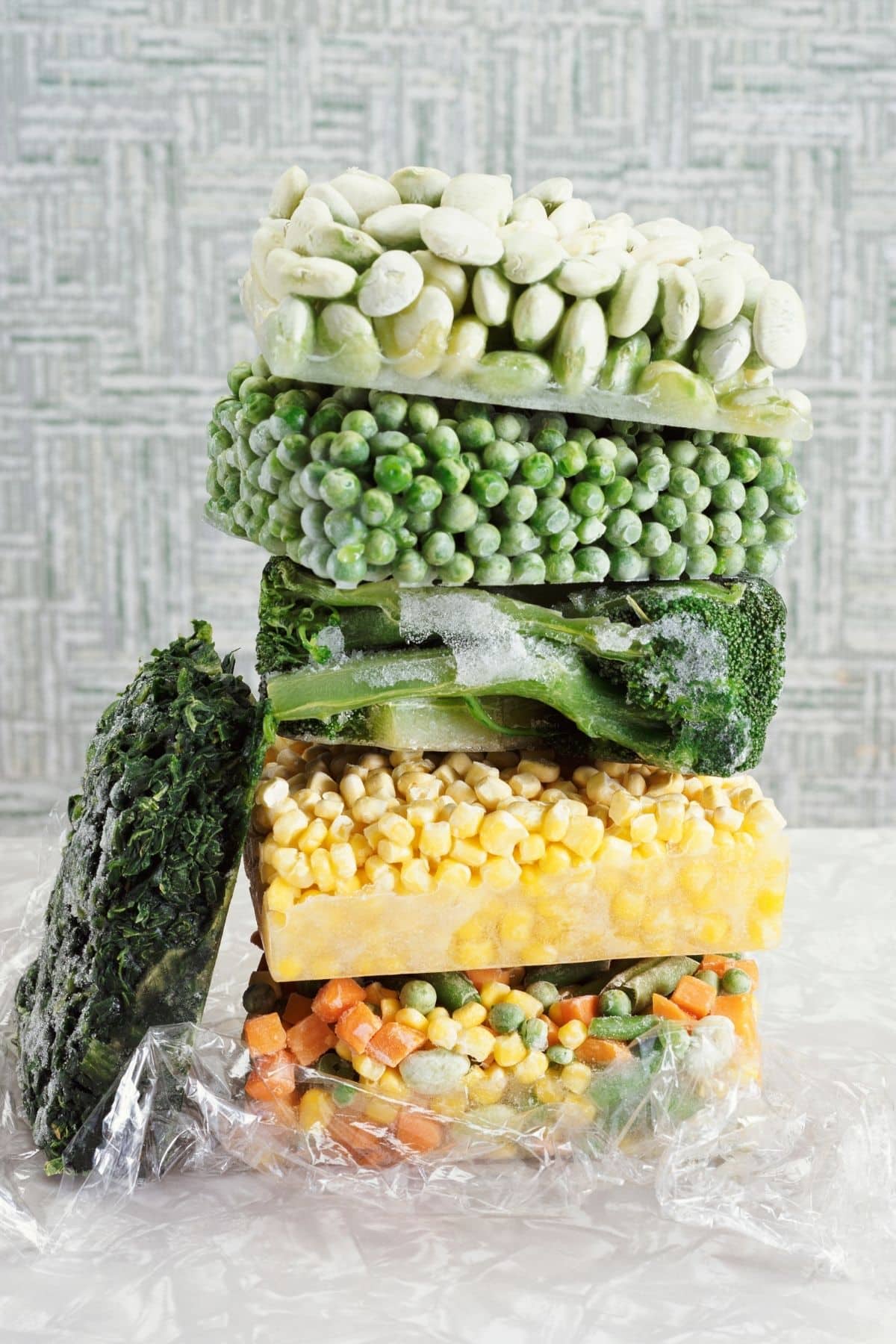 Frozen vegetables stacked together.