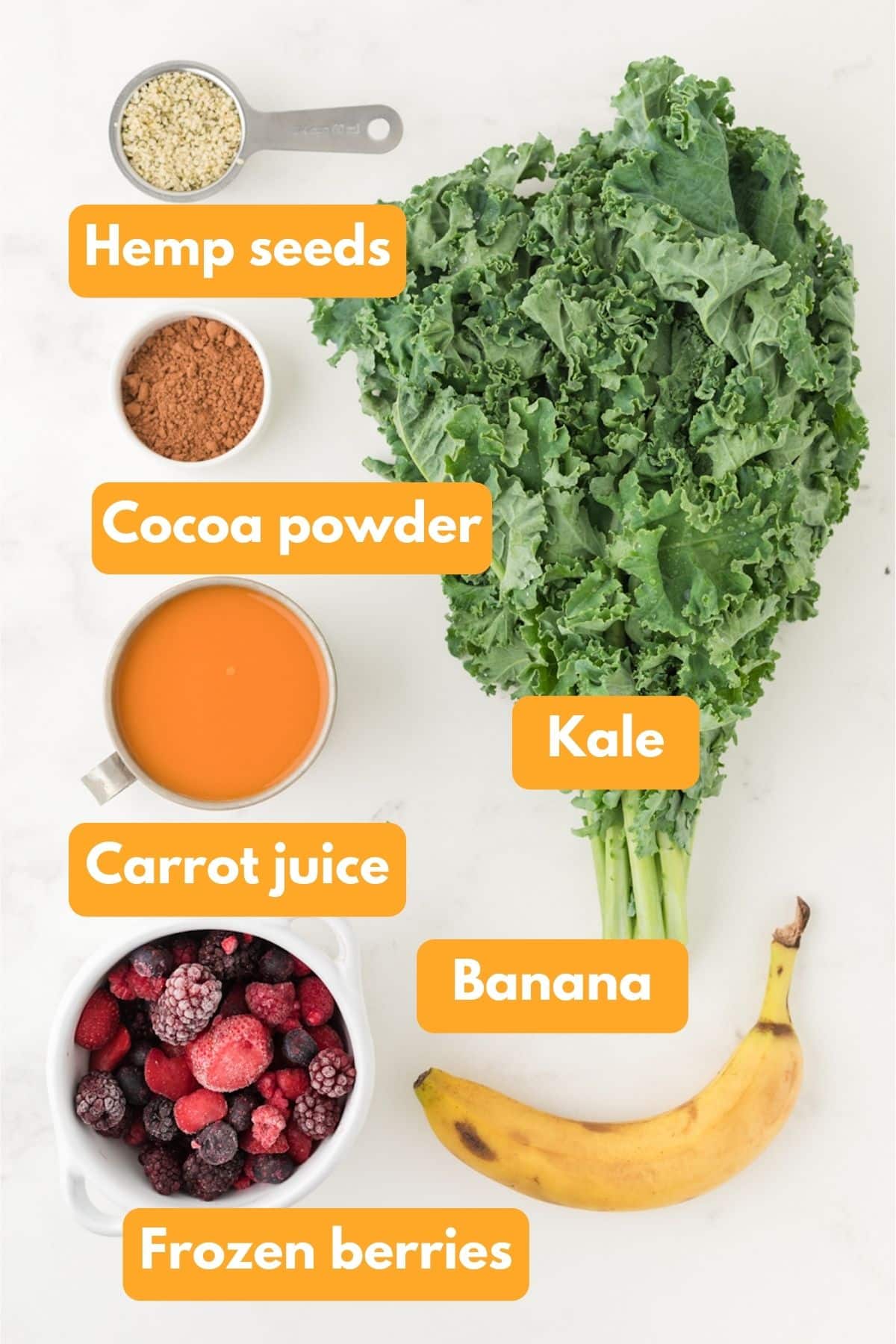 Ingredients for a chocolate berry kale smoothie on a table