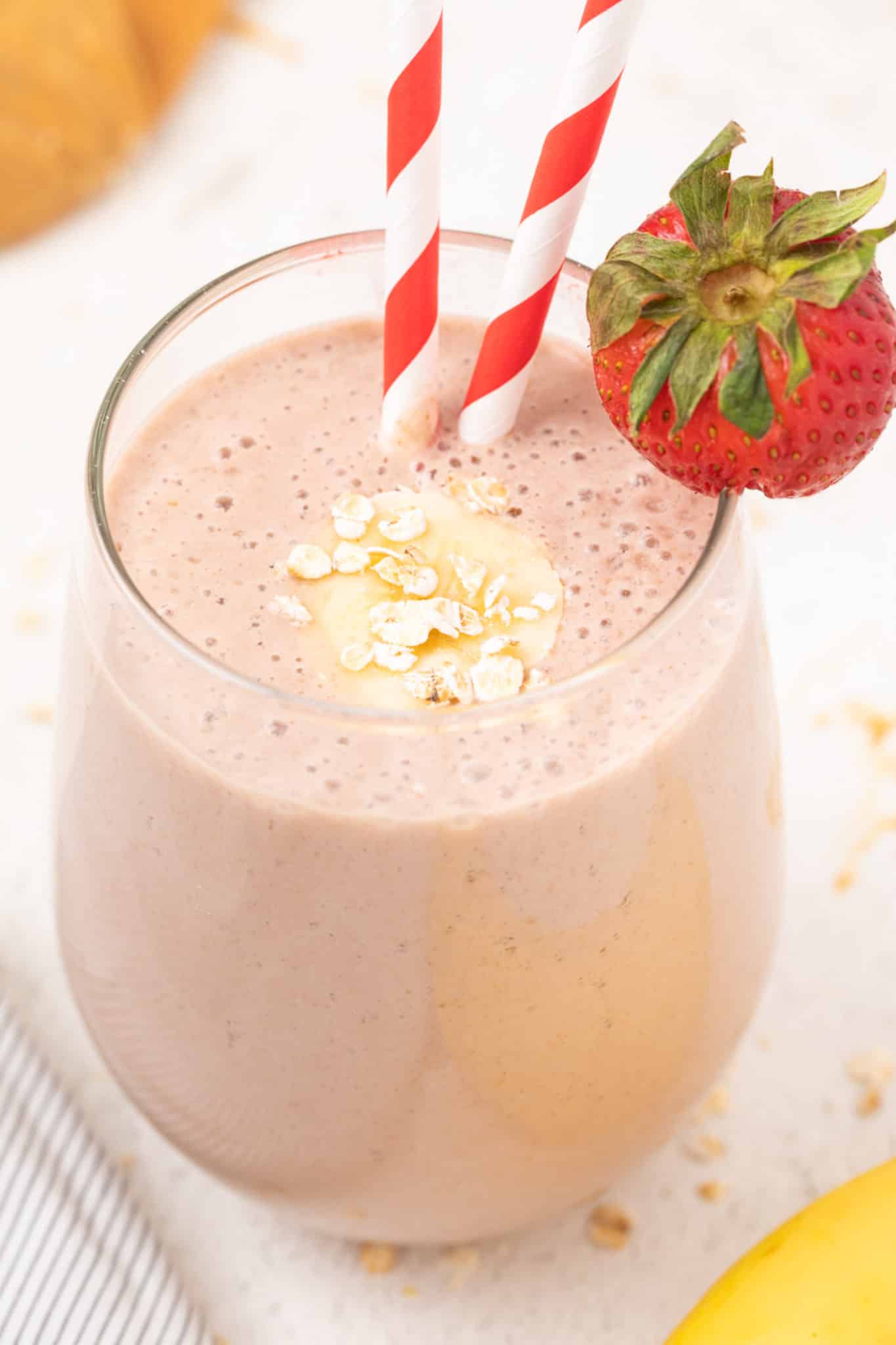Oat milk strawberry banana smoothie served in a glass