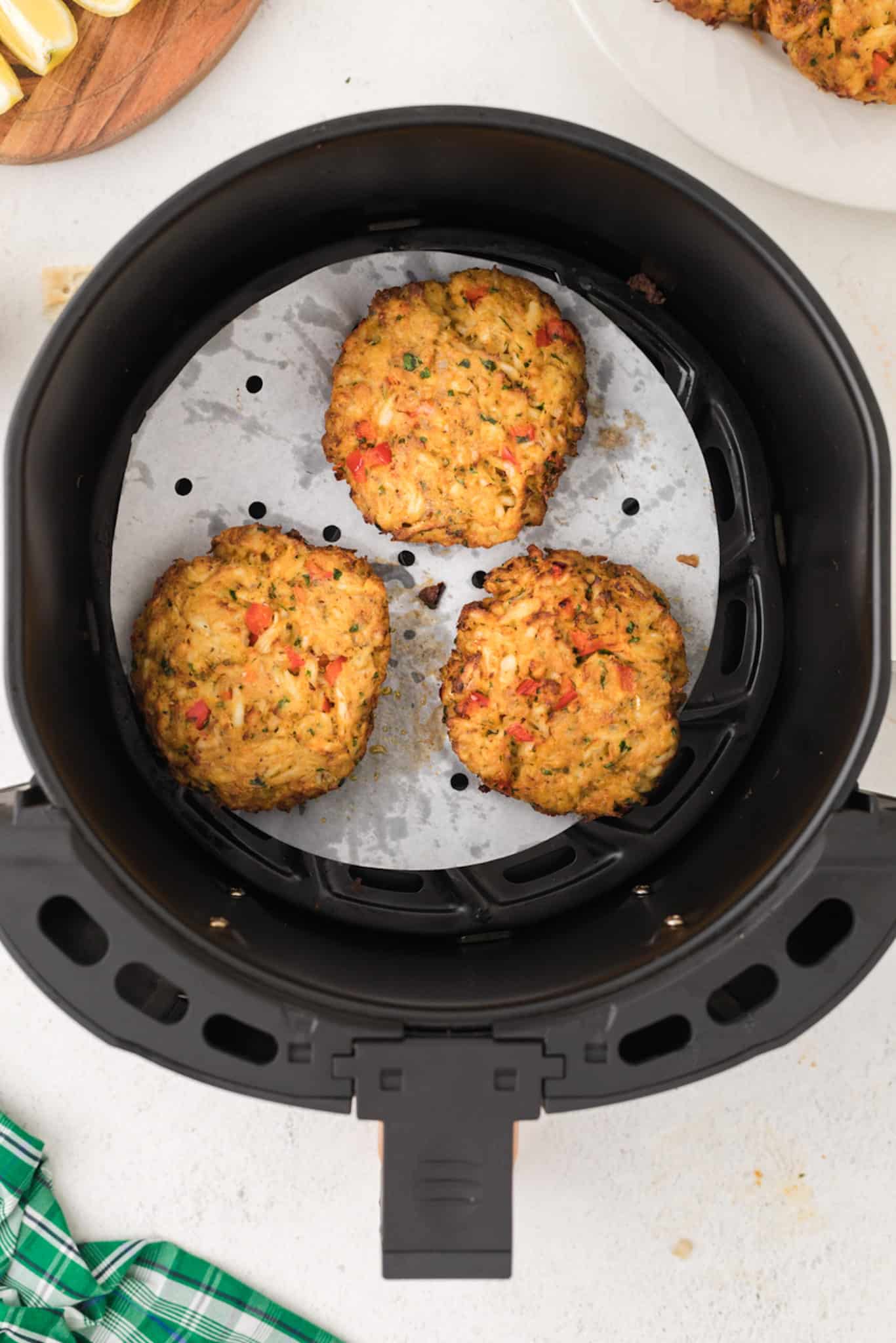 cooked crab cakes in an air fryer.