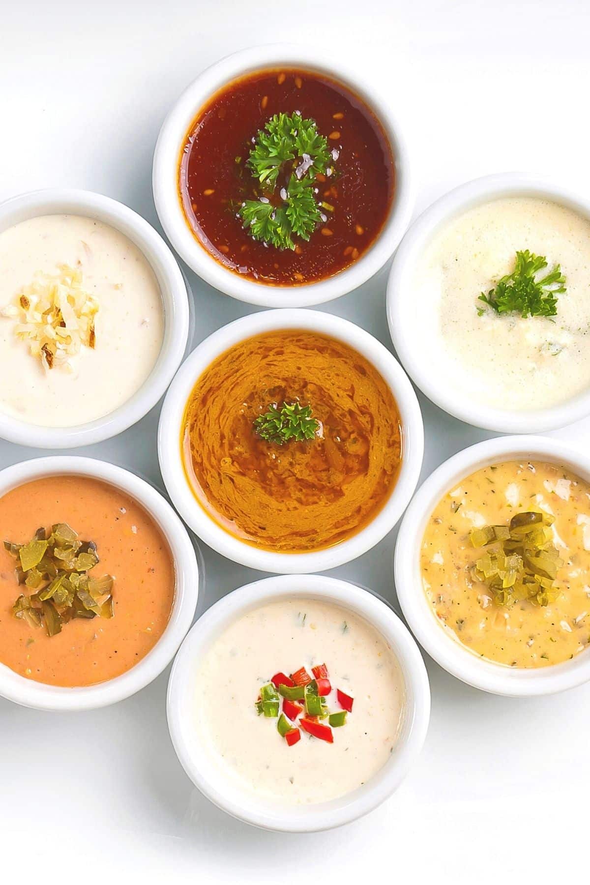Bowls of different gluten free sauces on table.