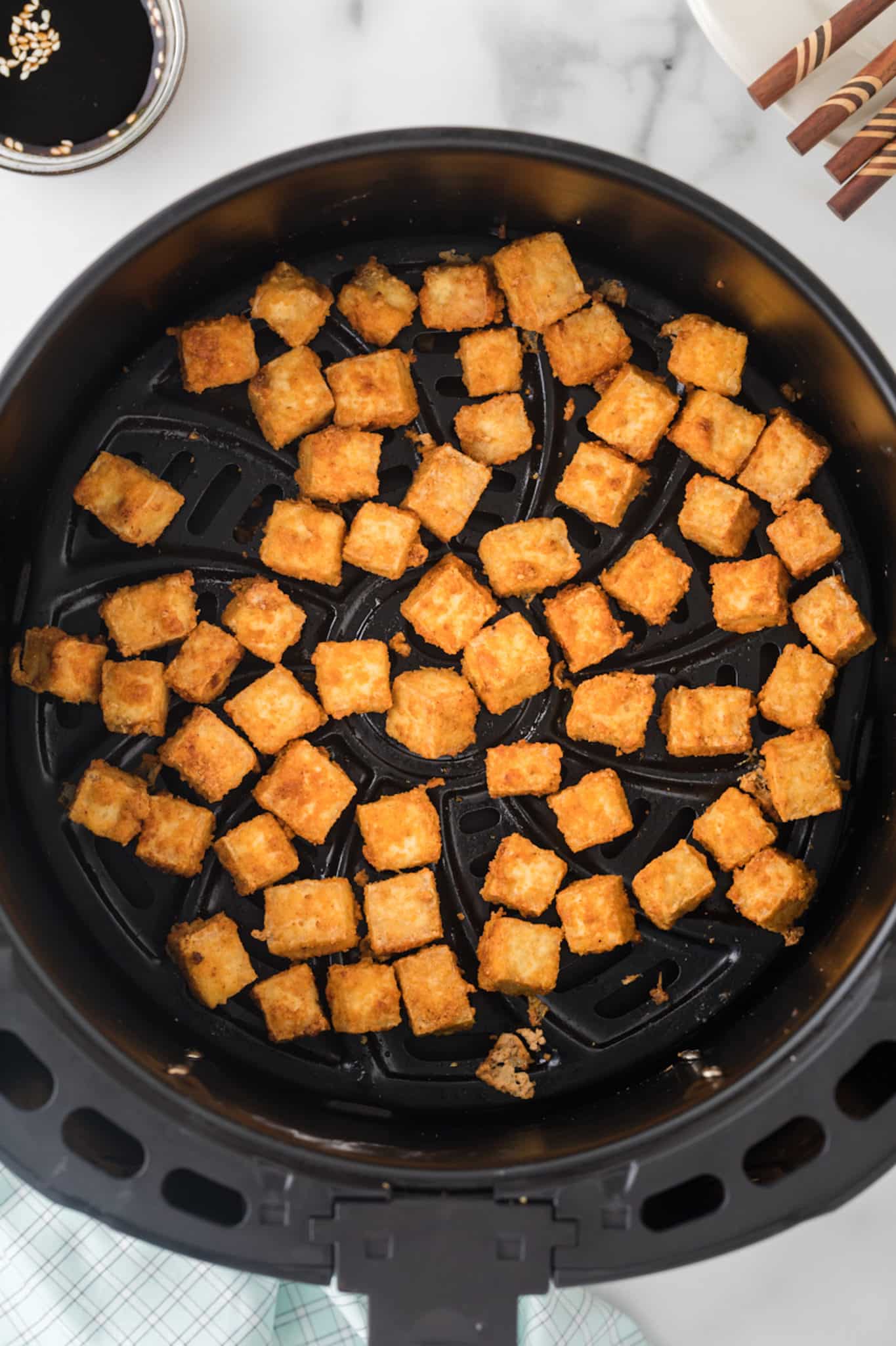 crispy tofu in air fryer basket