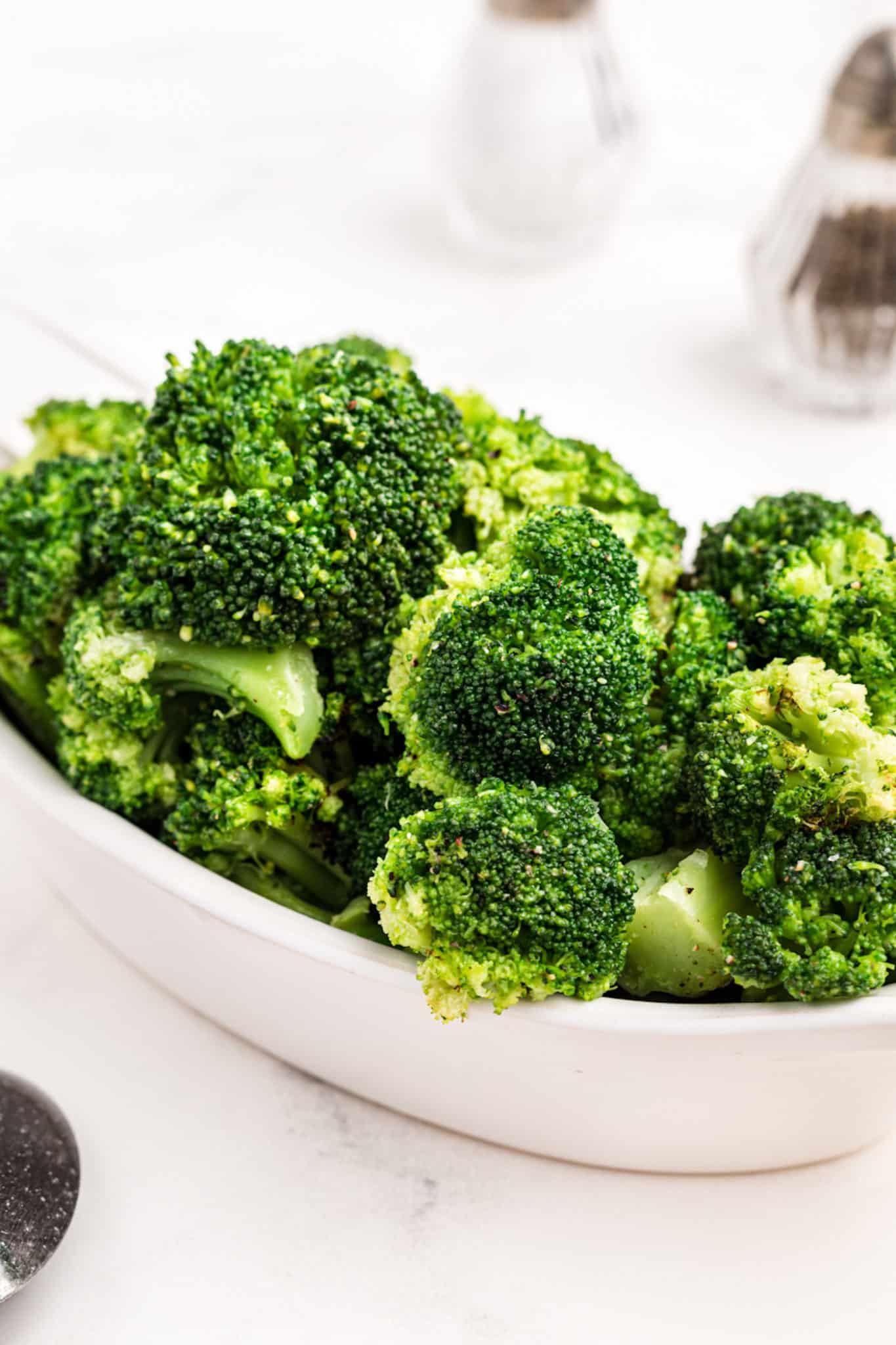 instant pot steamed broccoli served in a white dish
