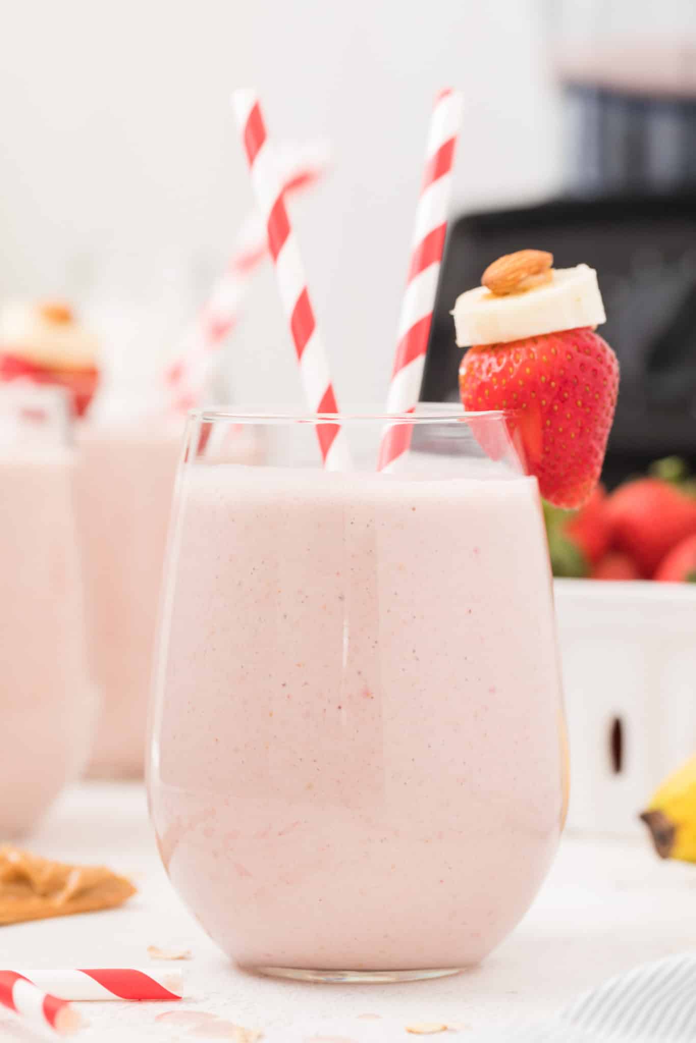 strawberry banana oatmeal smoothie served in a glass on a table