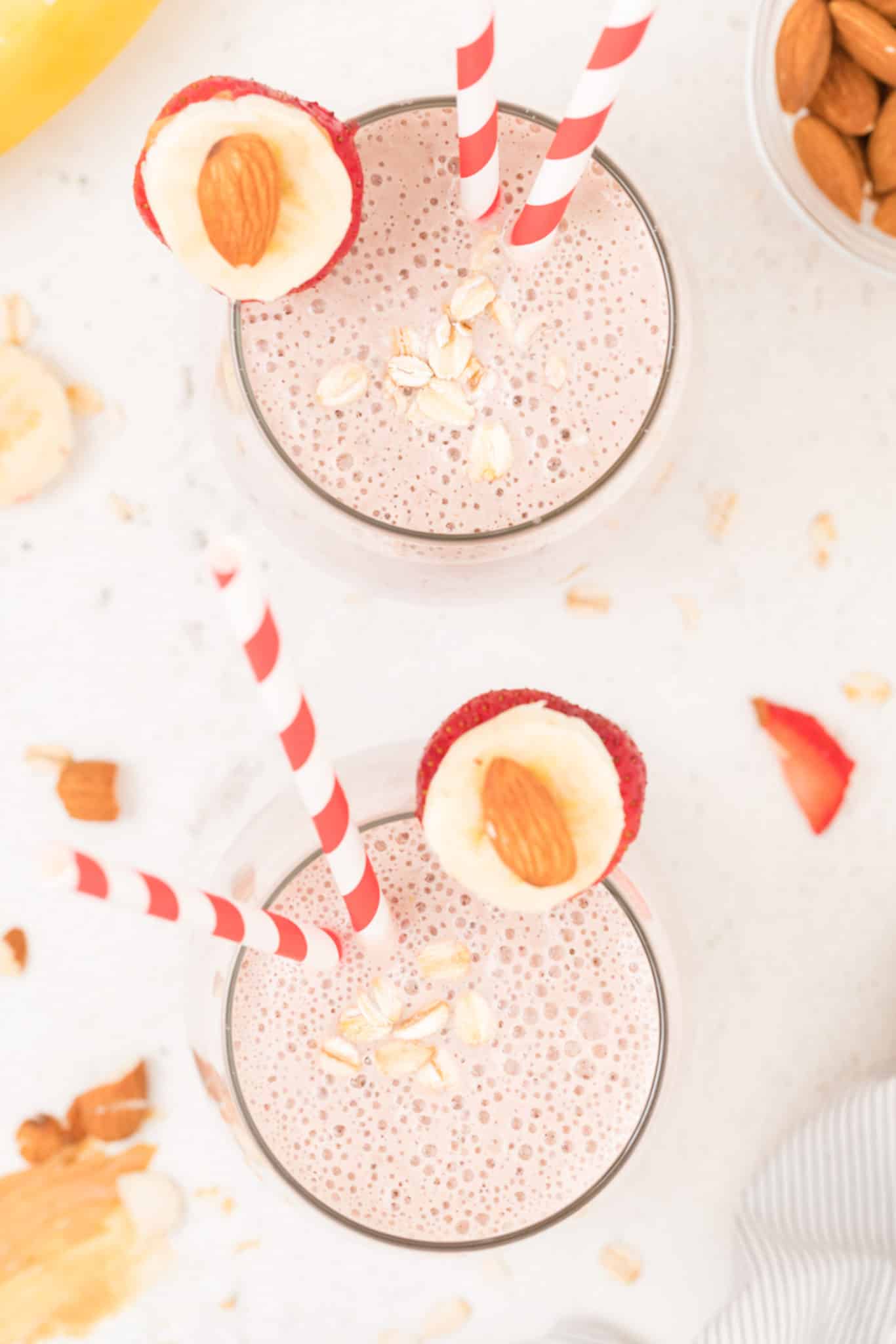 two glasses of strawberry oatmeal banana smoothie