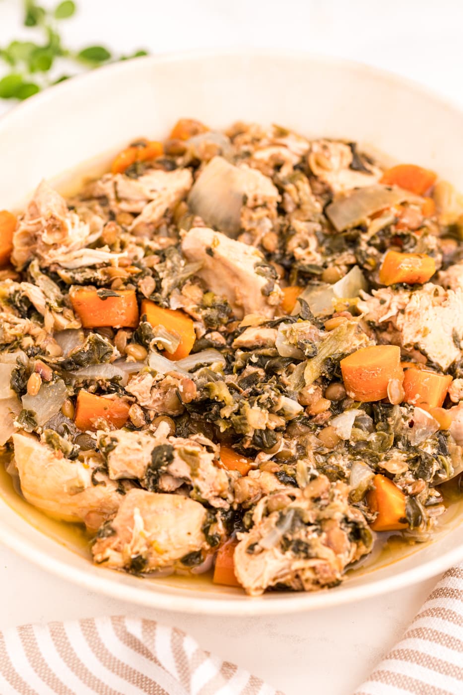 bowl of cooked chicken stew with spinach