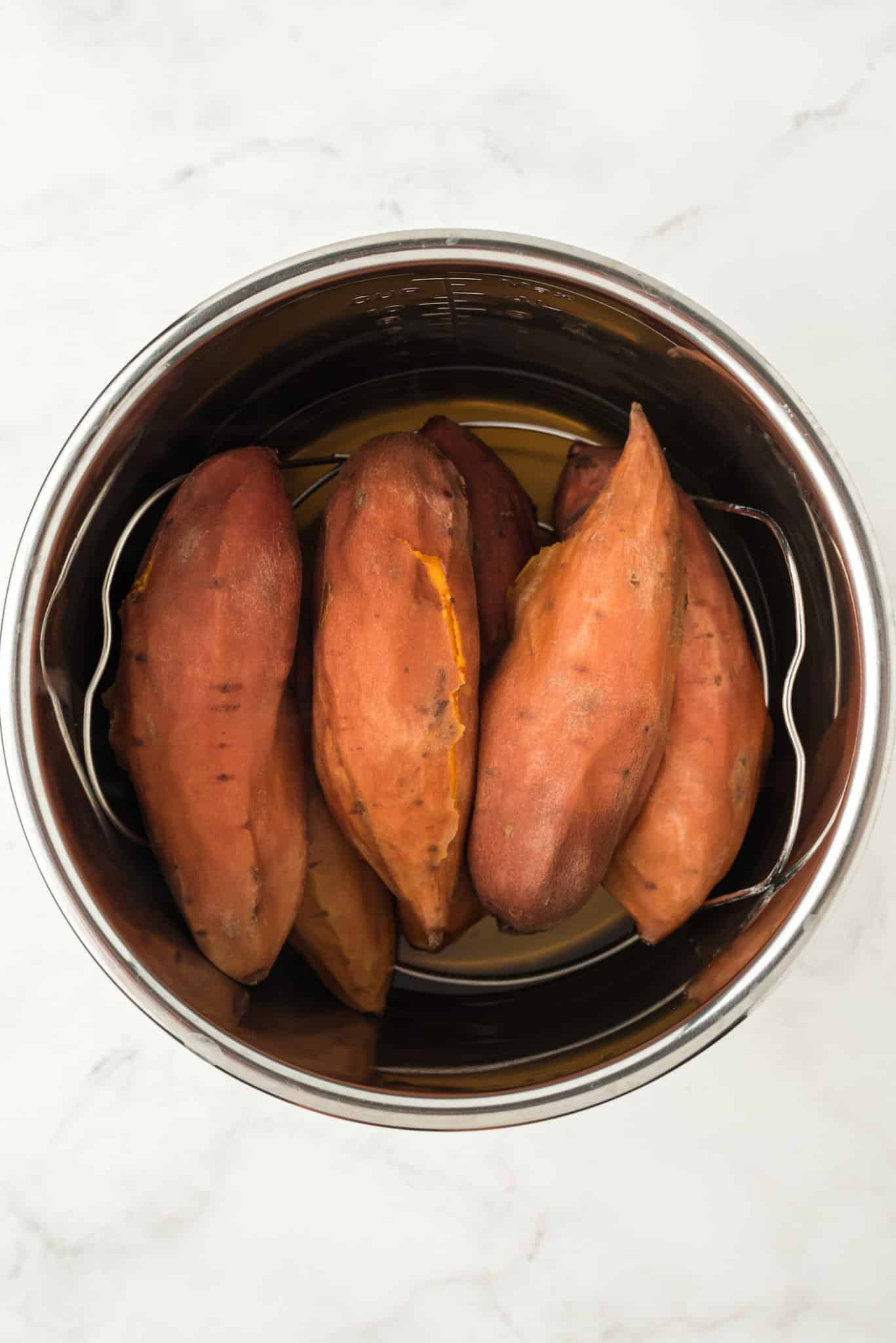 baked sweet potatoes inside pressure cooker.