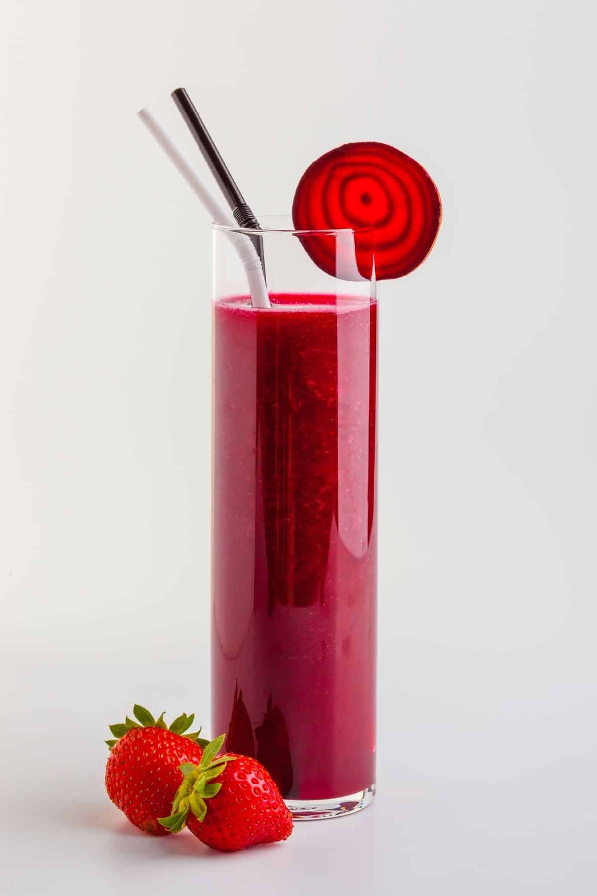 beet juice served in a skinny glass.