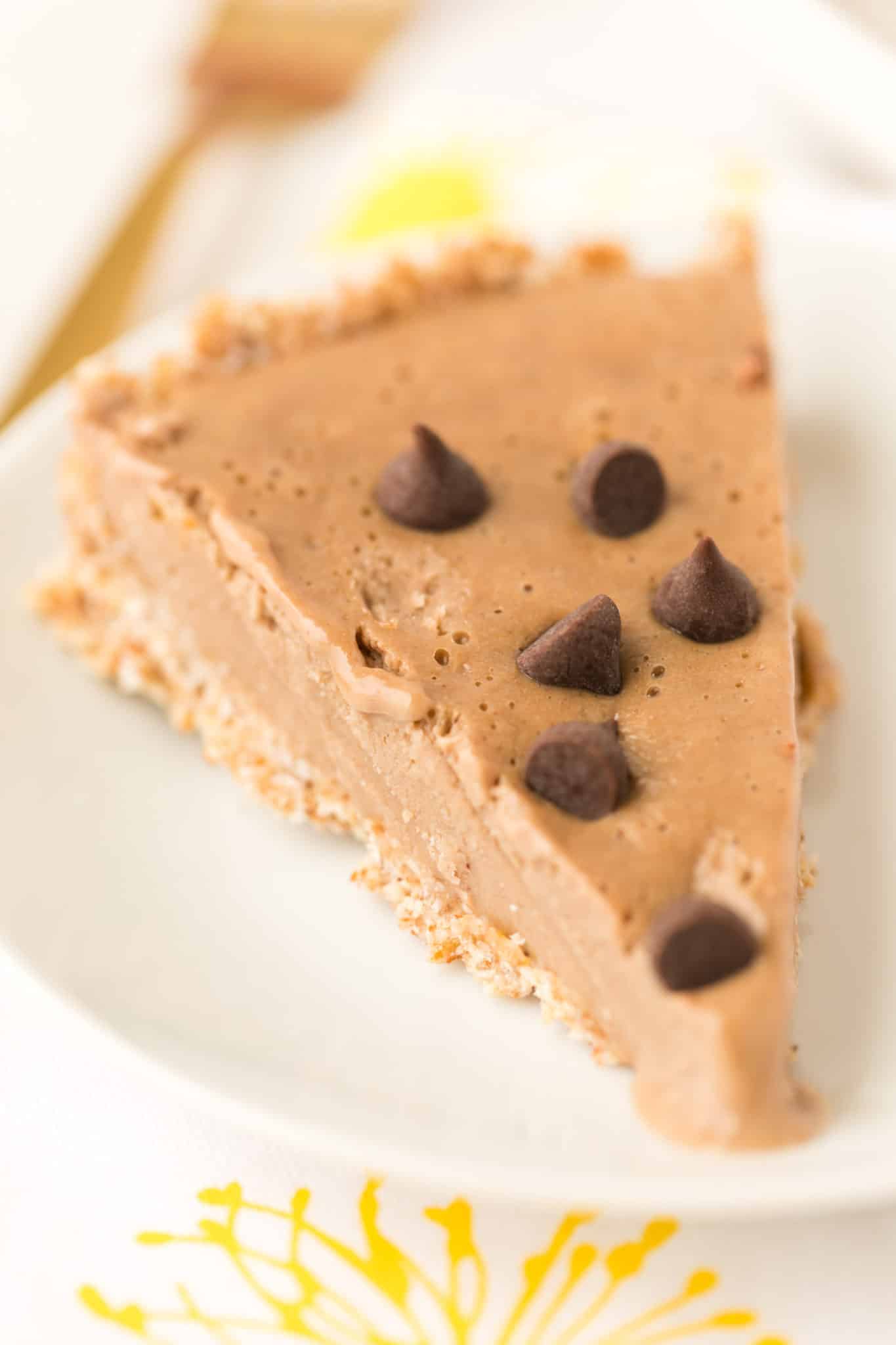 piece of chocolate peanut butter pie with chocolate chips on top
