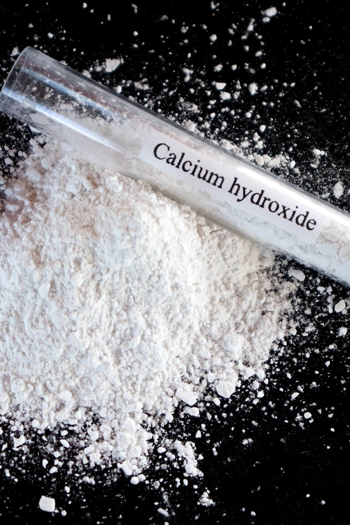 calcium hydroxide on a black background.